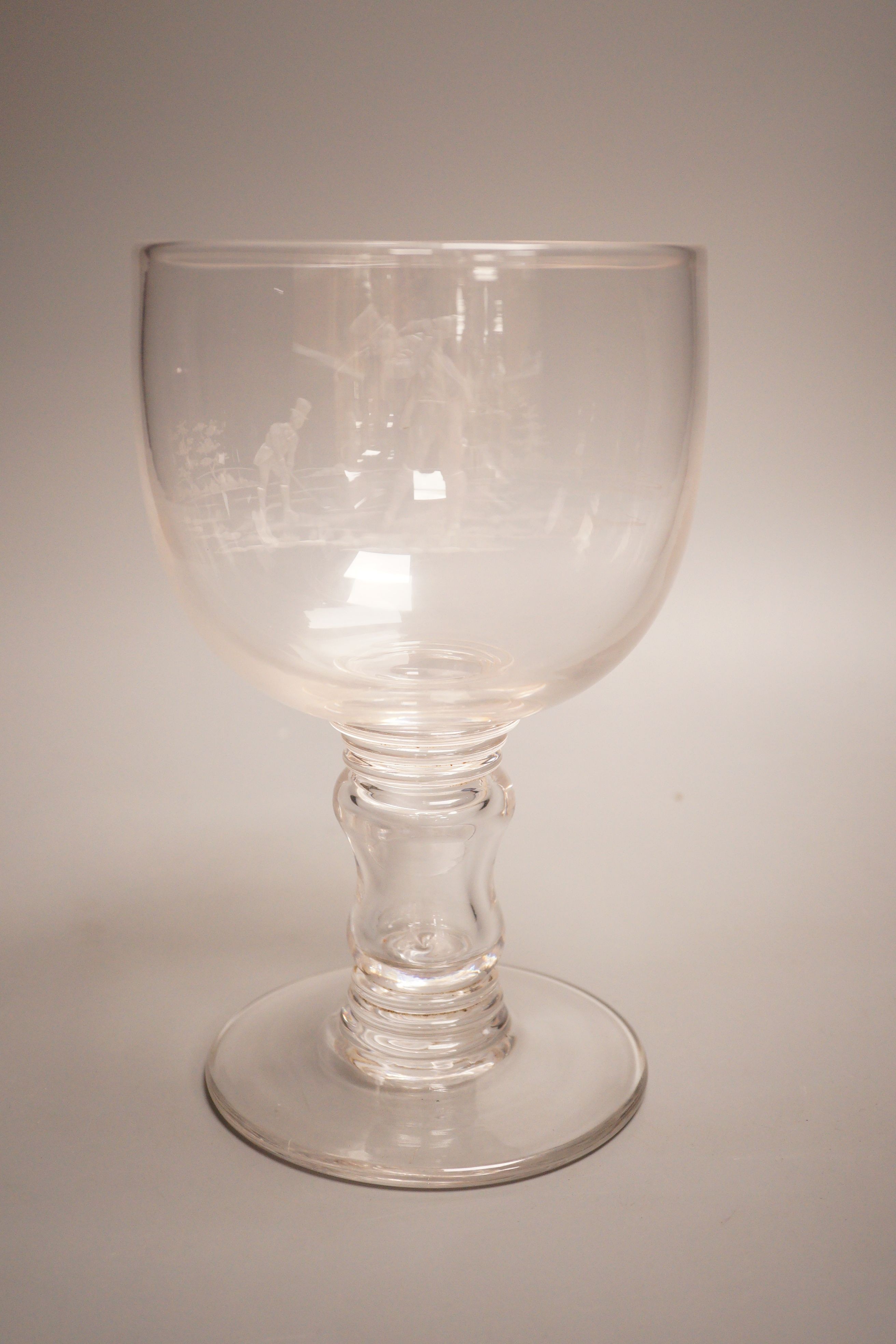 Golfing interest - a Victorian wheel engraved glass goblet, depicting two golfers, height 23cm